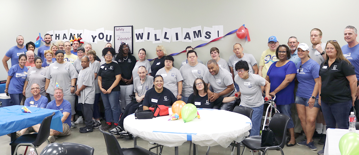 Volunteers from Williams Company with supported workers and Goodwill staff at Goodwill Contract Services on United Way Day of Caring 2019.