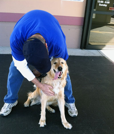 Goodwill donation attendant and Baxter the dog